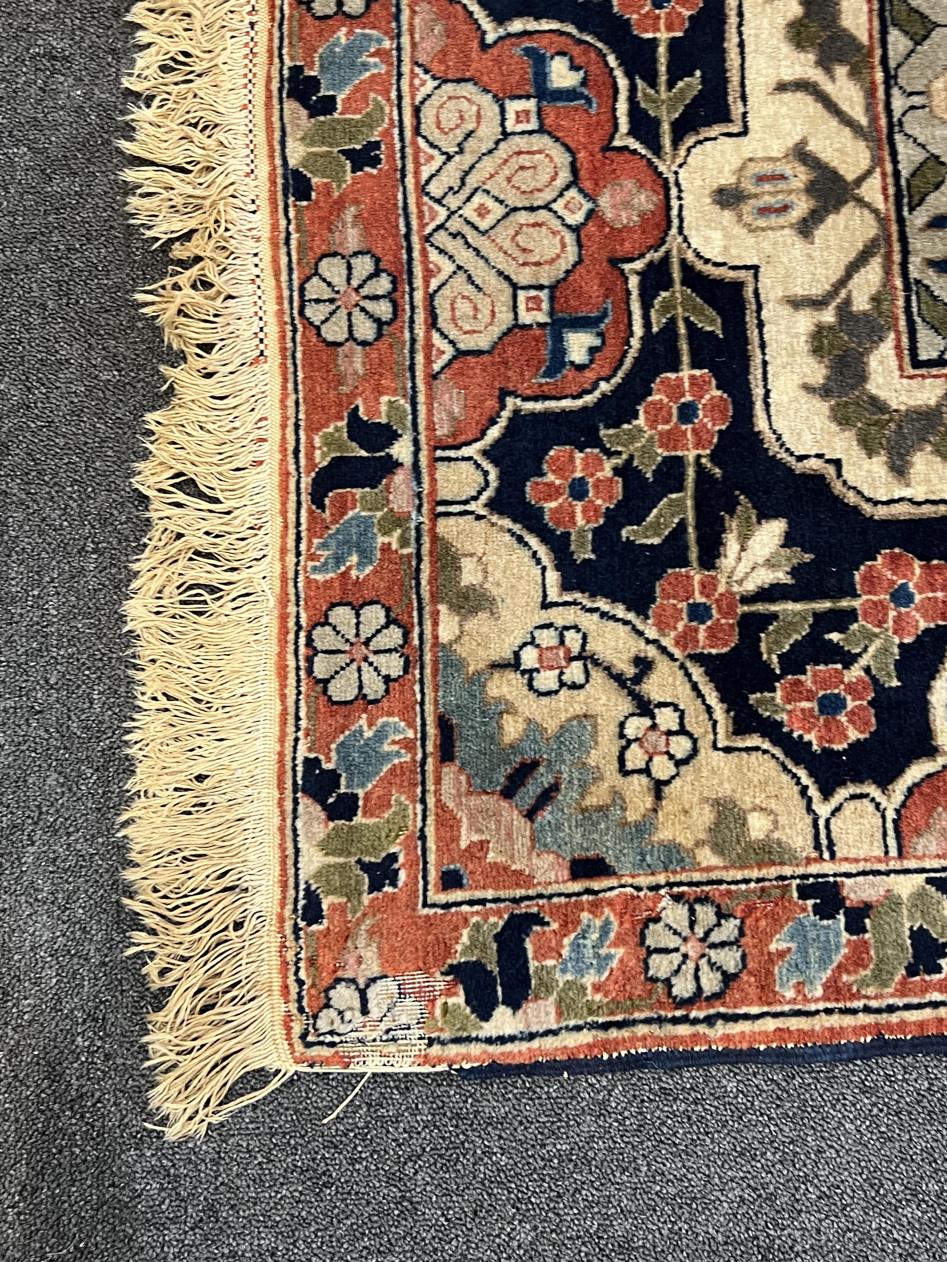An early 20th century Benlian Tabriz carpet, signed Mahmud, 320 x 225cm